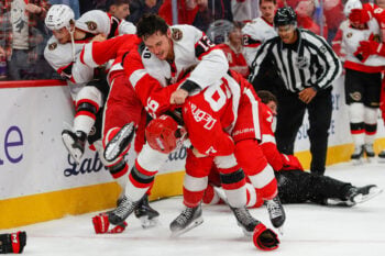 Oct 6, 2026; Detroit, Michigan, USA;  Detroit Red Wings right wing Alex DeBrincat (93) and Ottawa Senators center Shane Pinto (12) fight during the second period at Little Caesars Arena.  Mandatory Credit: Brian Bradshaw Sevald-Imagn Images     TPX IMAGES OF THE DAY