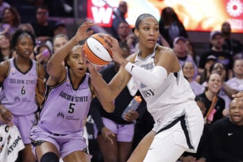 Oct 7, 2026; San Francisco, California, USA; Las Vegas Aces center A'ja Wilson (22) controls the ball ahead of Golden State Valkyries forward Kayla Thornton (5) during the fourth quarter of game two of the second round for the 2026 WNBA Playoffs at Chase Center. Mandatory Credit: Kelley L Cox-Imagn Images