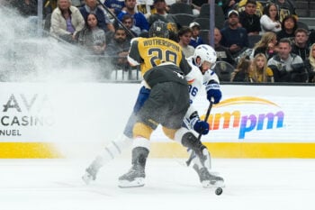 Oct 8, 2026; Las Vegas, Nevada, USA;  Toronto Maple Leafs right wing Kirill Marchenko (86) shoots around Vegas Golden Knights defenseman Parker Wotherspoon (29) during the second period at T-Mobile Arena.  Mandatory Credit: Candice Ward-Imagn Images