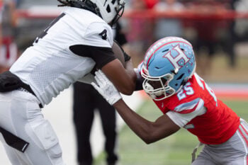 Oct. 9, 2026; Tuscaloosa, AL, USA;  Hillcrest's Jaylin Bennett (25) pushes McAdory’s Carter Feagin (4) out of bounds at Hillcrest High.