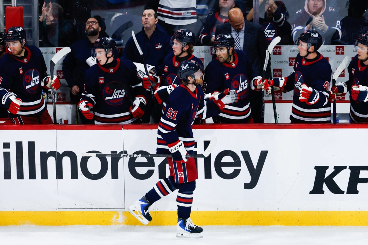 Oct 9, 2026; Winnipeg, Manitoba, CAN; Winnipeg Jets forward Kyle Connor (81) is congratulated by his teammates on his goal on Anaheim Ducks goalie Lukas Dostal (1) during the third period at Canada Life Centre. Mandatory Credit: Terrence Lee-Imagn Images