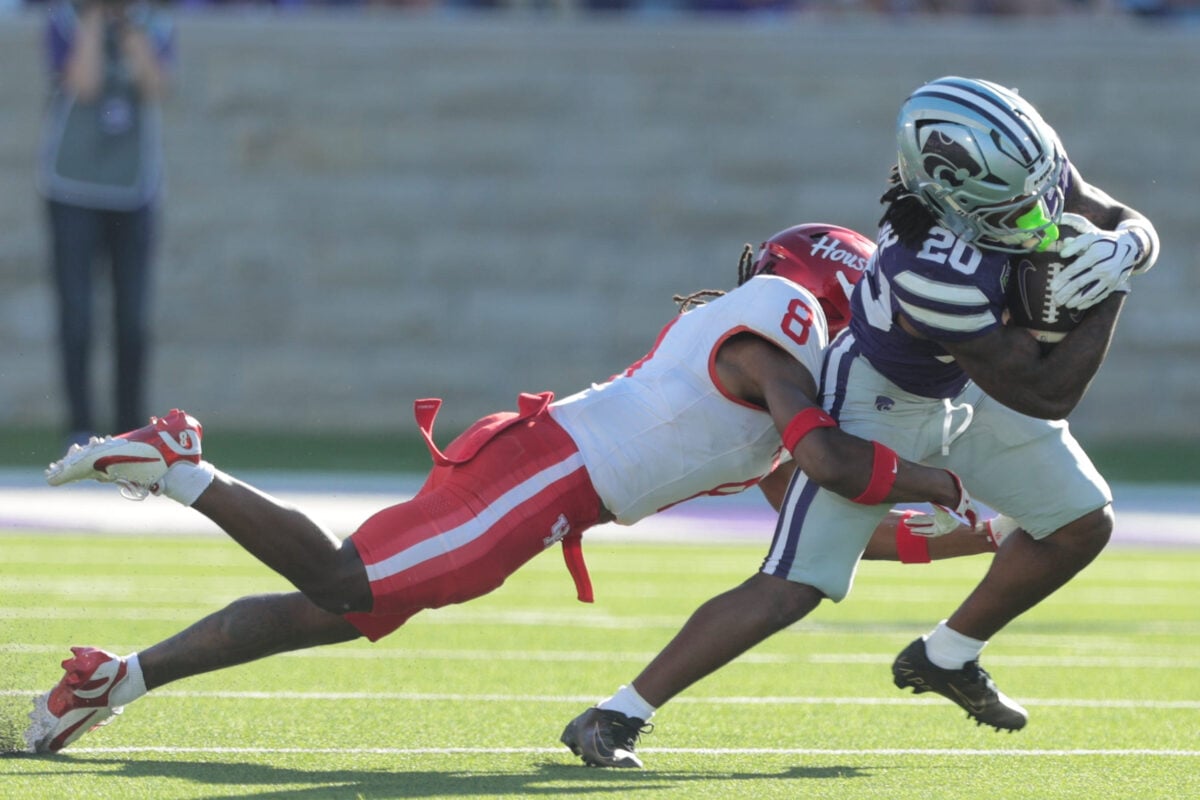 Kansas State Wildcats running back Rodney Fields Jr. (20) is tackled by Houston Cougars defensive back Kentrell Webb (8) during the game inside Bill Snyder Family Stadium in Manhattan, Kansas, on Oct. 10, 2026.