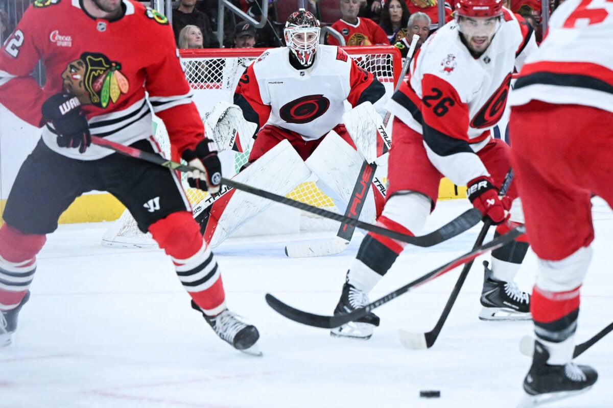 Oct 10, 2026; Chicago, Illinois, USA; Carolina Hurricanes goaltender Brandon Bussi (32) watches the puck during the first period against the Chicago Blackhawks at the United Center. Mandatory Credit: Matt Marton-Imagn Images