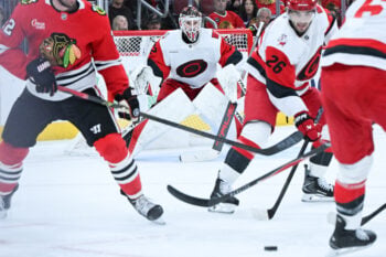Oct 10, 2026; Chicago, Illinois, USA;  Carolina Hurricanes goaltender Brandon Bussi (32) watches the puck during the first period against the Chicago Blackhawks  at the United Center.  Mandatory Credit: Matt Marton-Imagn Images