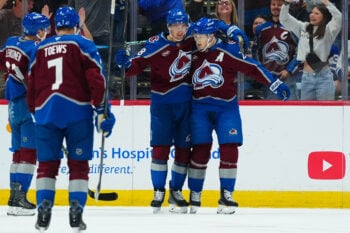 Oct 10, 2026; Denver, Colorado, USA;  Colorado Avalanche center Nathan MacKinnon (29) celebrates his second goal of the first period with center Martin Necas (88) against the Toronto Maple Leafs at Ball Arena.  Mandatory Credit: Ron Chenoy-Imagn Images