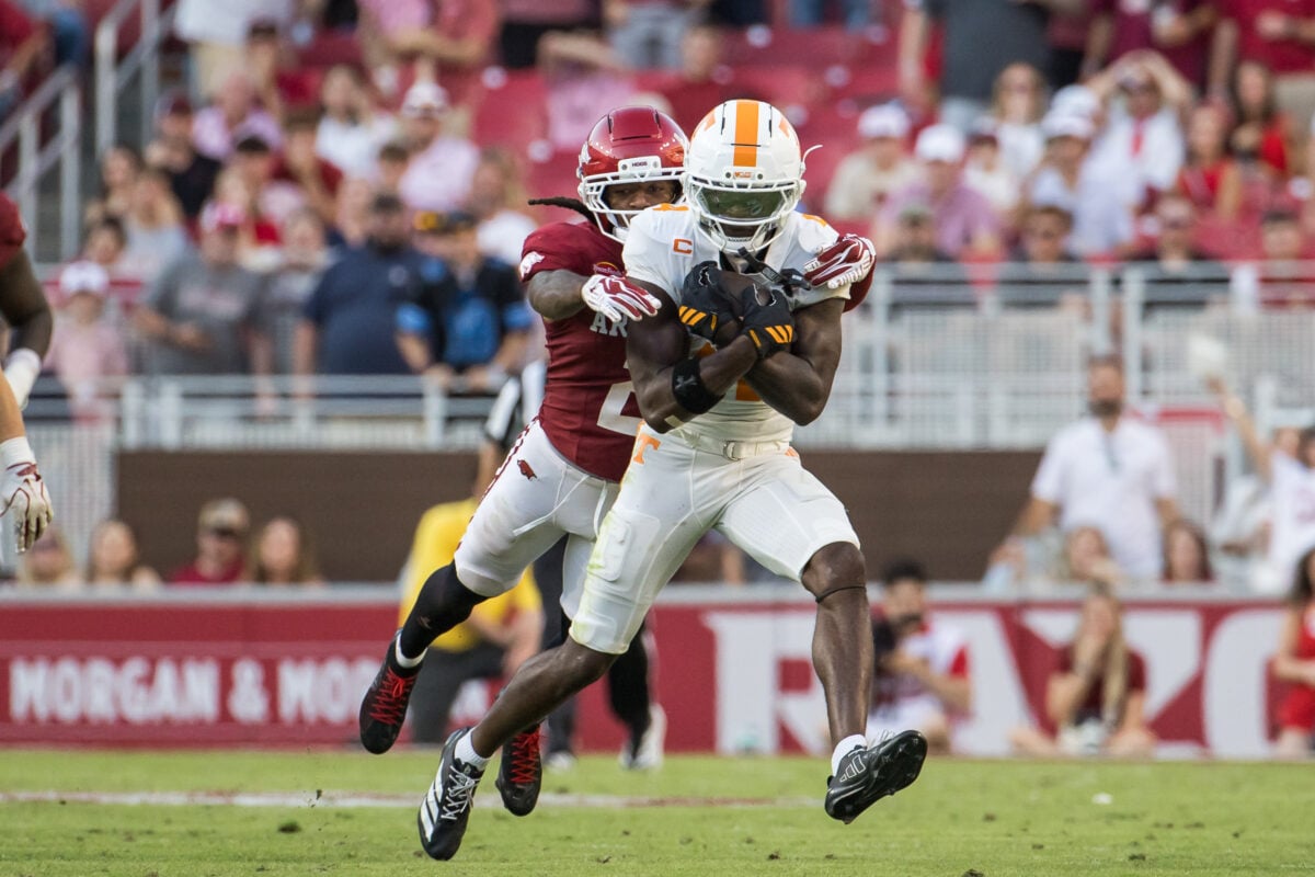 Oct 10, 2026; Fayetteville, Arkansas, USA; Arkansas Razorbacks defensive back Shelton Lewis (2) tackles Tennessee Volunteers wide receiver Mike Matthews (4) during the fourth quarter at Donald W. Reynolds Razorback Stadium. Mandatory Credit: Brett Rojo-Imagn Images