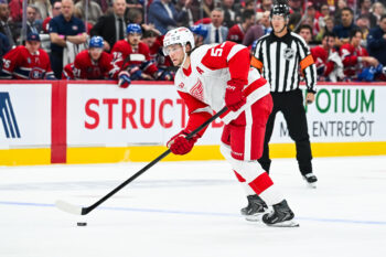 Oct 10, 2026; Montreal, Quebec, CAN;  Detroit Red Wings defenseman Moritz Seider (53) plays the puck against the Montreal Canadiens during the second period at Bell Centre.  Mandatory Credit: David Kirouac-Imagn Images
