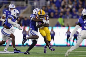 Oct 10, 2026; Lexington, Kentucky, USA;  LSU Tigers wide receiver Winston Watkins Jr. (6) is tackled by Kentucky Wildcats defensive back Jordan Castell (5) during the third quarter at Kroger Field.  Mandatory Credit: Jordan Prather-Imagn Images
