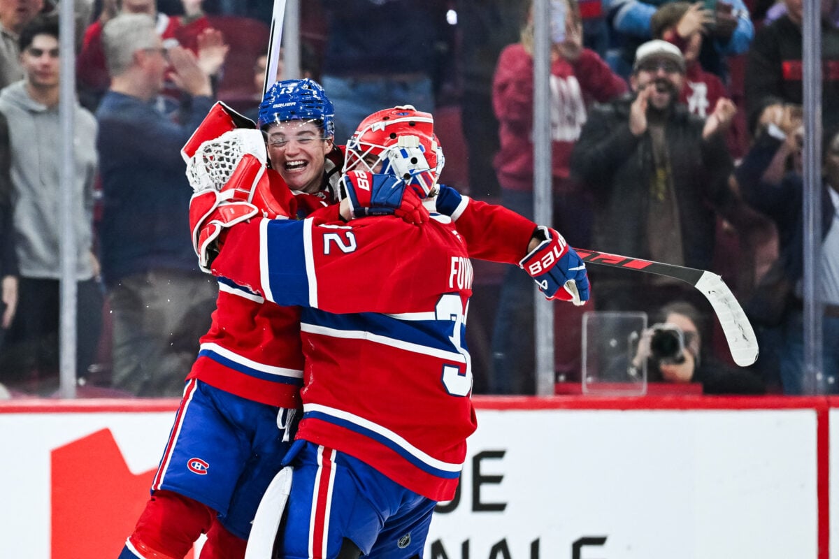 Oct 10, 2026; Montreal, Quebec, CAN; Montreal Canadiens right wing Cole Caufield (13) jumps on goalie Jacob Fowler (32) to celebrate the win against the Detroit Red Wings at Bell Centre. Mandatory Credit: David Kirouac-Imagn Images