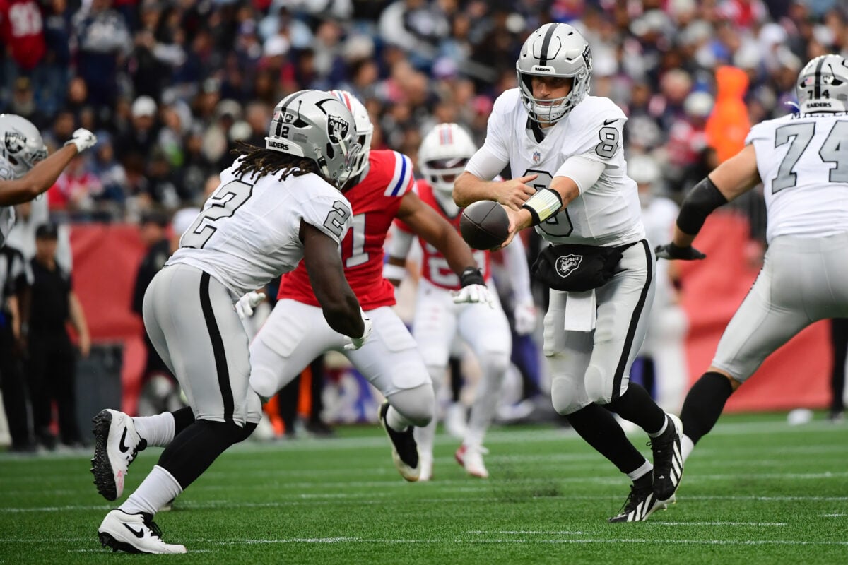 Oct 11, 2026; Foxborough, Massachusetts, USA; Las Vegas Raiders quarterback Kirk Cousins (8) hands the ball off to running back Ashton Jeanty (2) during the second half at Gillette Stadium. Mandatory Credit: Bob DeChiara-Imagn Images