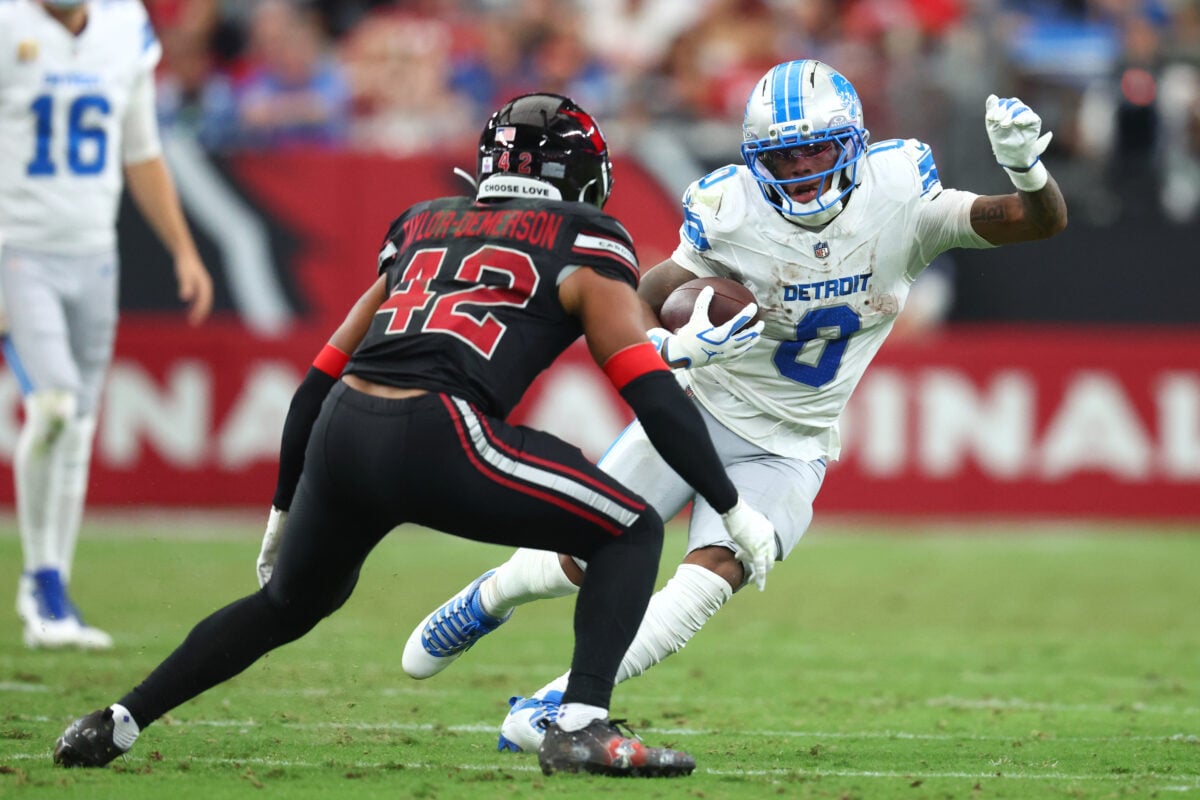 Oct 11, 2026; Glendale, Arizona, USA; Detroit Lions running back Jahmyr Gibbs (0) carries the ball defended by Arizona Cardinals safety Dadrion Taylor-Demerson (42) during the third quarter at State Farm Stadium. Mandatory Credit: Mark J. Rebilas-Imagn Images
