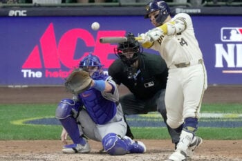 Oct 12, 2026; Milwaukee, Wisconsin, USA; Milwaukee Brewers catcher William Contreras (24) hits an RBI single during the sixth inning of their National League Championship Series game against the Los Angeles Dodgers at American Family Field on Oct 12, 2026.Mandatory Credit: Mark Hoffman-USA TODAY Network via Imagn Images