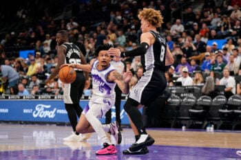 Oct 12, 2026; Salt Lake City, Utah, USA;  Utah Jazz guard Trey Alexander (15) dribbles against San Antonio Spurs guard Taelon Peter (8) during the second half at Delta Center.  Mandatory Credit: Aaron Baker-Imagn Images