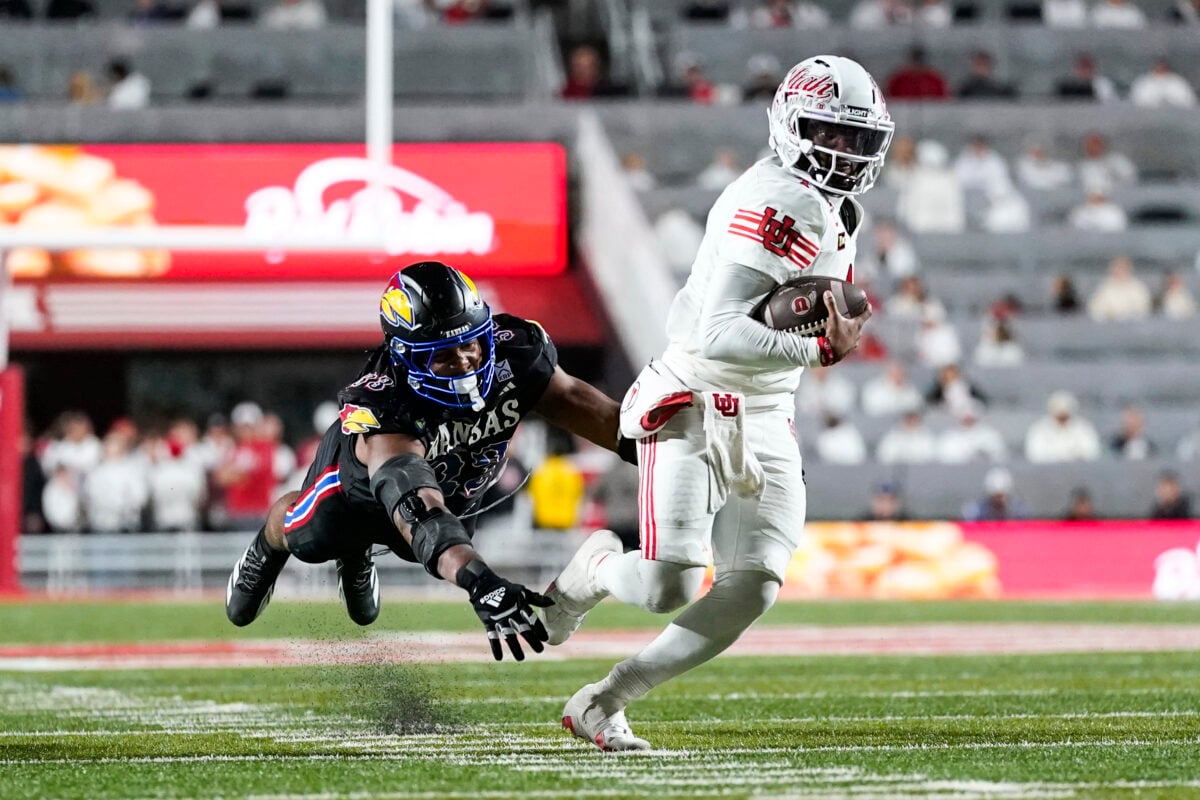 Oct 10, 2026; Salt Lake City, Utah, USA; Kansas Jayhawks defensive end Leroy Harris III (33) dives after Utah Utes quarterback Devon Dampier (4) during the second half at Rice-Eccles Stadium. Mandatory Credit: Aaron Baker-Imagn Images