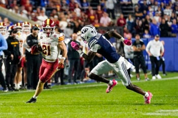 Oct 9, 2026; Provo, Utah, USA; Iowa State Cyclones running back Aiden Flora (21) runs the ball while being defended by BYU Cougars cornerback Therrian Alexander III (1) during the second half at LaVell Edwards Stadium. Mandatory Credit: Aaron Baker-Imagn Images