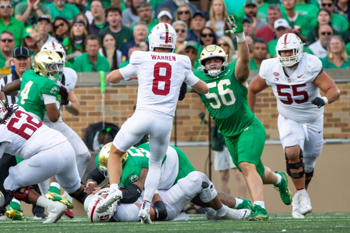 Oct 10, 2026; South Bend, Indiana, USA; Notre Dame Fighting Irish defensive tackle Elijah Hughes (56) tries to stop Stanford Cardinal quarterback Davis Warren (8) from throwing during the second half at Notre Dame Stadium. Mandatory Credit: Michael Caterina-Imagn Images