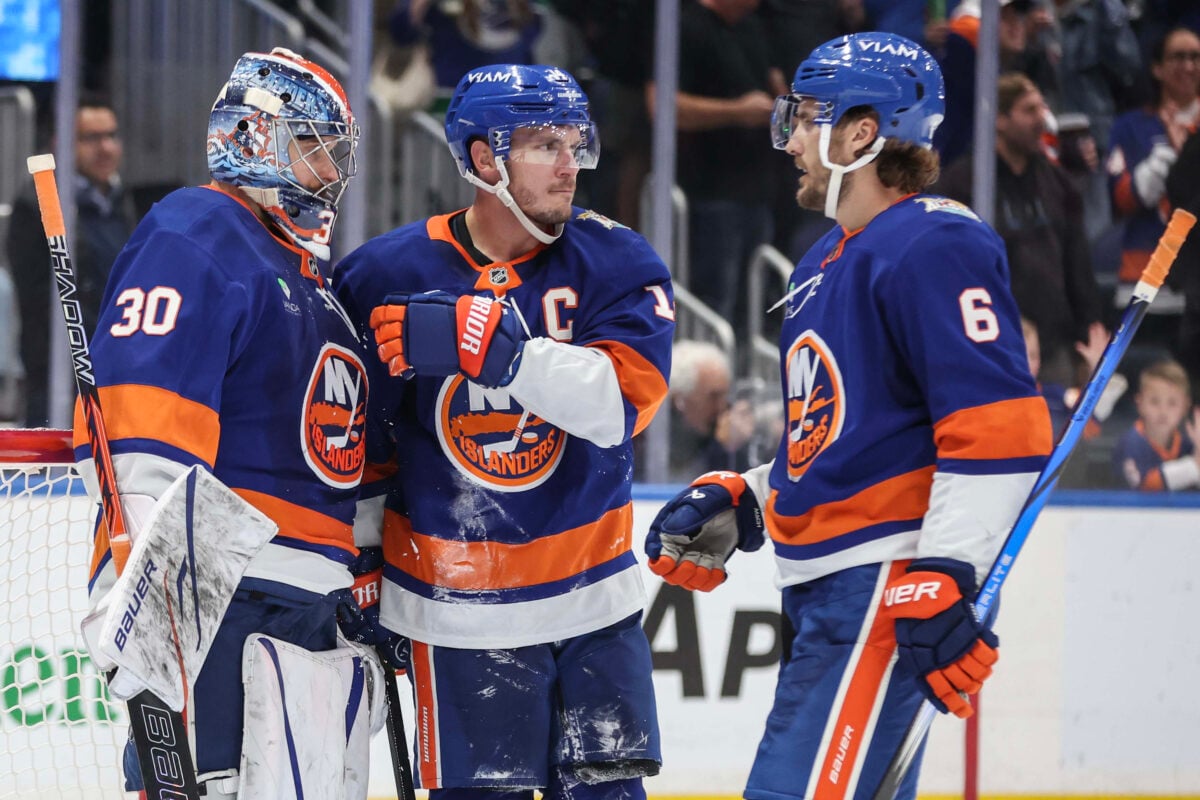 Oct 13, 2026; Elmont, New York, USA;  New York Islanders goaltender Ilya Sorokin (30) is greeted by center Bo Horvat (14), and defenseman Ryan Pulock (6) after defeating the Vancouver Canucks 3-2 at UBS Arena. Mandatory Credit: Wendell Cruz-Imagn Images