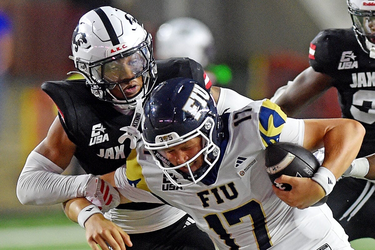 FIU quarterback JJ Kohl is sacked by Jax State safety Kaden Cook during college school football action at AmFirst Stadium in Jacksonville, Alabama October 13, 2026.  (Dave Hyatt / Hyatt Media LLC)