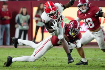Georgia running back Dwight Phillips Jr. tries to avoid the tackle attempt of Alabama defensive back Zabien Brown (2) at Saban Field at Bryant-Denny Stadium.
