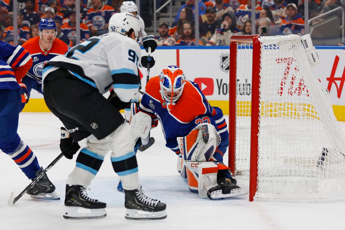 Oct 15, 2026; Edmonton, Alberta, CAN; Utah Mammoth forward Logan Cooley (92) scores a goal during the second period against Edmonton Oilers goaltender Devon Levi (27) at Rogers Place. Mandatory Credit: Perry Nelson-Imagn Images