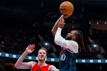 Oct 10, 2026; Vancouver, British Columbia, CAN; Los Angeles Clippers guard Darius Garland (10) shoots over Toronto Raptors center Jakob Poeltl (19) in the first half at Rogers Arena. Mandatory Credit: Bob Frid-Imagn Images
