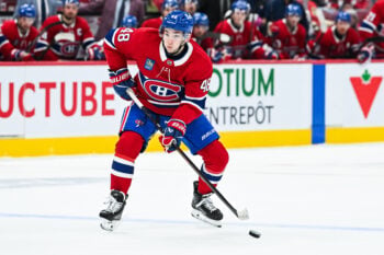 Oct 10, 2026; Montreal, Quebec, CAN; Montreal Canadiens defenseman Lane Hutson (48) plays the puck near the blue line against the Detroit Red Wings during the first period at Bell Centre. Mandatory Credit: David Kirouac-Imagn Images