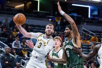 Oct 16, 2026; Indianapolis, Indiana, USA;  Indiana Pacers guard Braden Smith (3) passes the ball while Milwaukee Bucks center Kel'el Ware (9) defends in the second half at Gainbridge Fieldhouse.  Mandatory Credit: Trevor Ruszkowski-Imagn Images