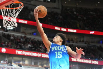 Oct 16, 2026; Chicago, Illinois, USA;  Minnesota Timberwolves guard Zyon Pullin (15) scores against the Chicago Bulls during the second half at United Center.  Mandatory Credit: David Banks-Imagn Images