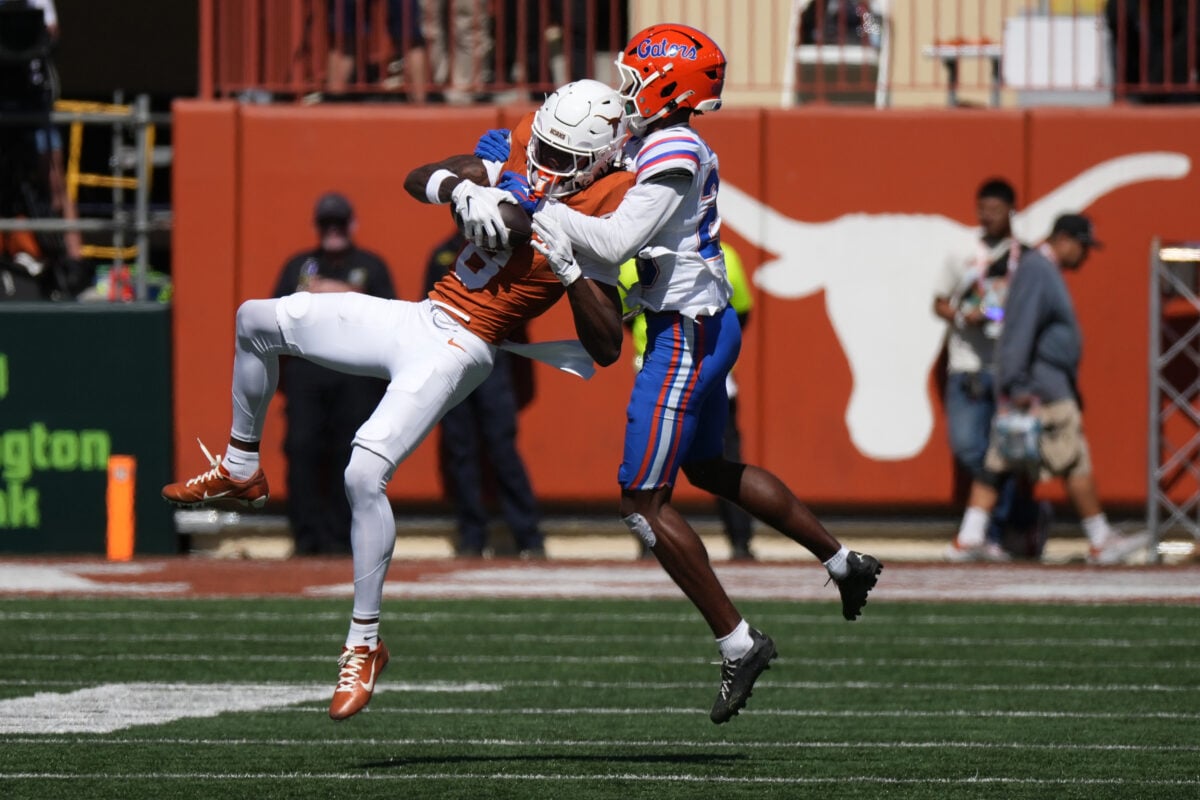 Oct 17, 2026; Austin, Texas, USA;  Texas Longhorns wide receiver Cam Coleman (8) makes a catch while defended by Florida Gators cornerback Cormani McClain (25) during the second half at Darrell K Royal-Texas Memorial Stadium.  Mandatory Credit: Scott Wachter-Imagn Images