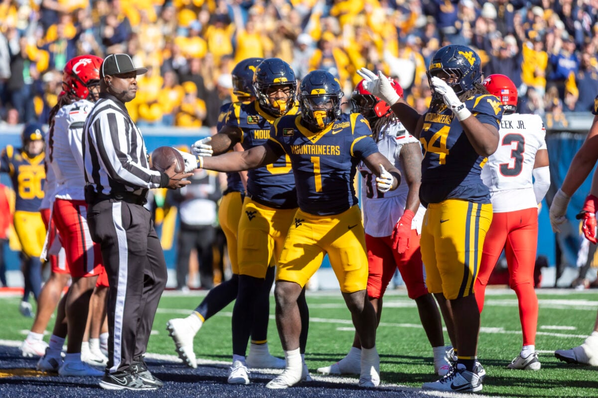 Oct 17, 2026; Morgantown, West Virginia, USA;  West Virginia Mountaineers running back Amari Latimer (1) celebrates after scoring a touchdown during the fourth quarter against the Cincinnati Bearcats at Milan Puskar Stadium.  Mandatory Credit: Ben Queen-Imagn Images