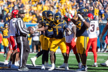 Oct 17, 2026; Morgantown, West Virginia, USA;  West Virginia Mountaineers running back Amari Latimer (1) celebrates after scoring a touchdown during the fourth quarter against the Cincinnati Bearcats at Milan Puskar Stadium.  Mandatory Credit: Ben Queen-Imagn Images