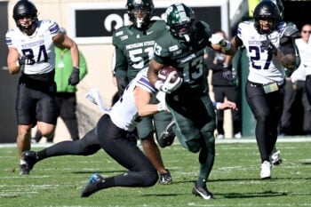 Oct 17, 2026; East Lansing, Michigan, USA;  Michigan State Spartans wide receiver Chrishon McCray (13) runs for a first down during the fourth quarter at Spartan Stadium.  Mandatory Credit: Dale Young-Imagn Images