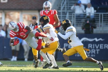 Oct 17, 2026; Oxford, Mississippi, USA;  at Vaught-Hemingway Stadium.Mississippi Rebels running back Kewan Lacy (5)is tackled by Missouri Tigers safety Santana Banner (15) and safety Trajen Greco (4) at Vaught-Hemingway Stadium.  Mandatory Credit: Petre Thomas-Imagn Images