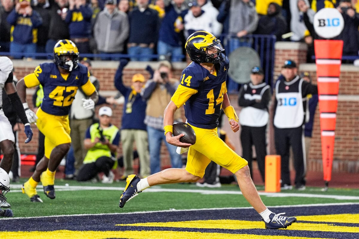 Michigan quarterback Tommy Carr runs into the end zone for a touchdown against Penn State late in the fourth quarter at Michigan Stadium in Ann Arbor on Saturday, Oct. 17, 2026.