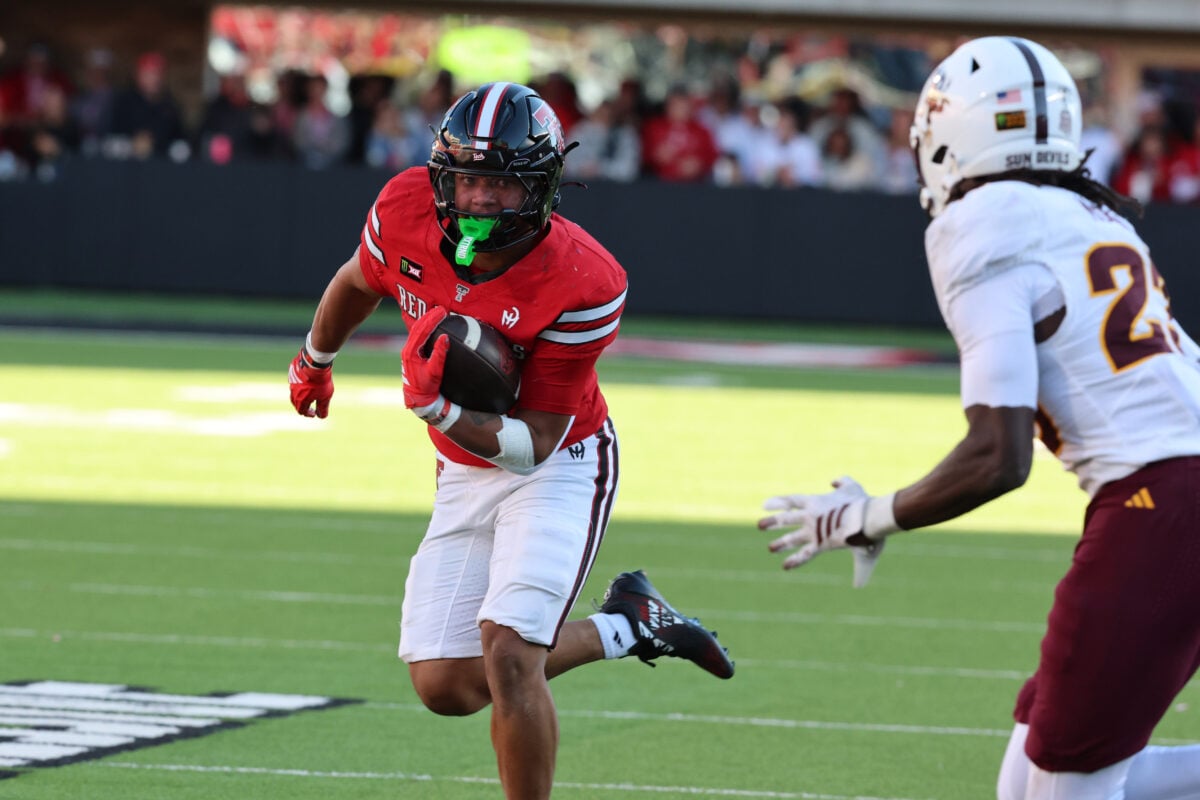 Oct 17, 2026; Lubbock, Texas, USA;  Texas Tech Red Raiders running back Quinten Joyner (0) rushes against Arizona State Sun Devils safety Jessie McGrew (23) in the second half at Galaxy Stadium.  Mandatory Credit: Michael C. Johnson-Imagn Images