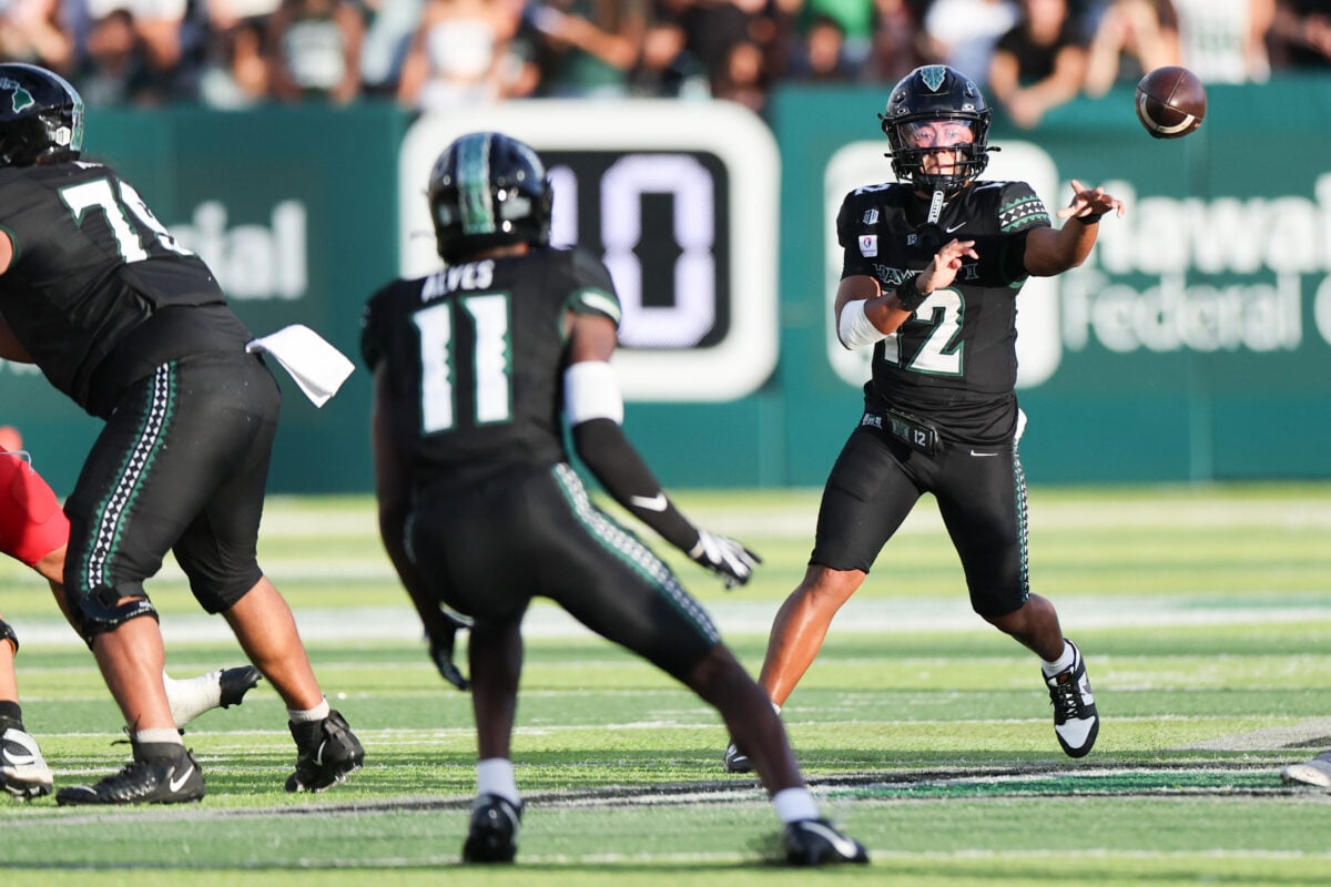 Oct 17, 2026; Honolulu, Hawaii, USA; Hawaii Rainbow Warriors quarterback Micah Alejado (12) makes a pass to wide receiver Devin Alves (11) against the New Mexico Lobos during the second quarter at the Clarence T.C. Ching Athletics Complex. Mandatory Credit: Marco Garcia-Imagn Images