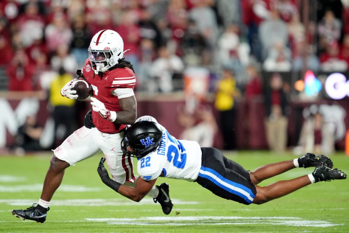 Oklahoma's Tory Blaylock (6) tries to get by Kentucky's Grant Godfrey (22) in the first half of the college football game between the University of Oklahoma Sooners (OU) and the Kentucky Wildcats at Gaylord Family — Oklahoma Memorial Stadium in Norman, Okla., Saturday, Oct., 17, 2026.
