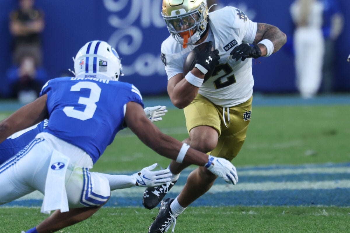 Oct 17, 2026; Provo, Utah, USA; Notre Dame Fighting Irish running back Nolan James Jr. (2) runs the ball against Brigham Young Cougars safety Raider Damuni (3) during the first half during the first half at LaVell Edwards Stadium. Mandatory Credit: Rob Gray-Imagn Images