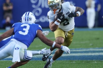 Oct 17, 2026; Provo, Utah, USA; Notre Dame Fighting Irish running back Nolan James Jr. (2) runs the ball against Brigham Young Cougars safety Raider Damuni (3) during the first half during the first half at LaVell Edwards Stadium. Mandatory Credit: Rob Gray-Imagn Images