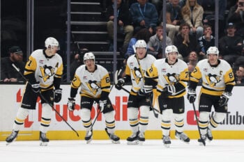 Oct 19, 2026; Salt Lake City, Utah, USA;  The Pittsburgh Penguins celebrate after a goal by defenseman Declan Carlile (72) during the third period against the Utah Mammoth at Delta Center.  Mandatory Credit: Rob Gray-Imagn Images