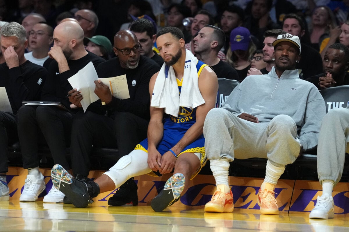 Oct 21, 2026; Los Angeles, California, USA; Golden State Warriors assistant coach Kris Weems (left) and guard Stephen Curry (30) react in the second half against the Los Angeles Lakers at Crypto.com Arena. Mandatory Credit: Kirby Lee-Imagn Images