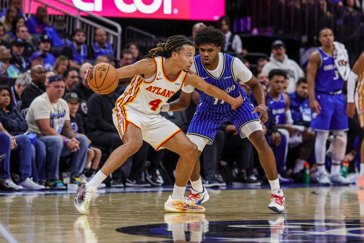 Oct 21, 2026; Orlando, Florida, USA; Orlando Magic guard Jase Richardson (11) defends Atlanta Hawks guard Kingston Flemings (4) during the second half at Kia Center. Mandatory Credit: Mike Watters-Imagn Images