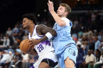 Oct 21, 2026; Memphis, Tennessee, USA;  Utah Jazz forward Brice Sensabaugh (28) drives against Memphis Grizzlies guard Cam Spencer (24) during the fourth quarter at FedExForum.  Mandatory Credit: Petre Thomas-Imagn Images