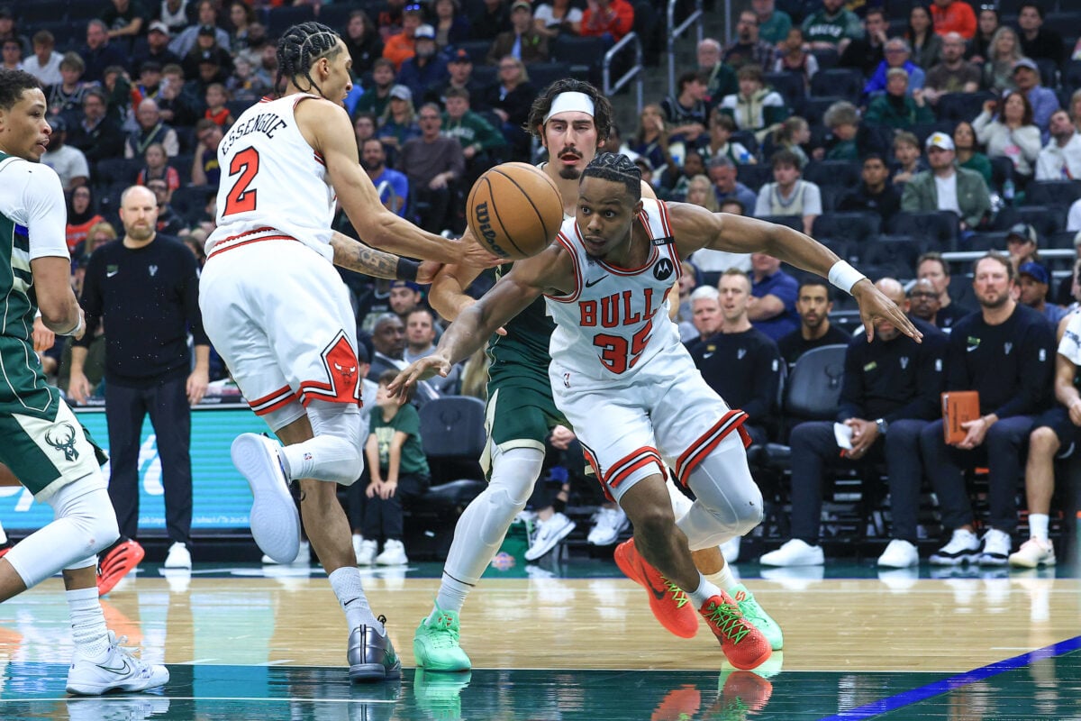 Oct 23, 2026; Milwaukee, WI, USA;  Chicago Bulls guard Isaac Okoro (35) battles for a loose ball against the Milwaukee Bucks during the fourth quarter at Fiserv Forum.  Mandatory Credit: Brad Repplinger-Imagn Images