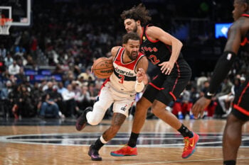 Oct 23, 2026; Washington, District of Columbia, USA; Washington Wizards guard Trae Young (3) drives as Toronto Raptors forward Allen Graves (22) defends during the first half at Capital One Arena. Mandatory Credit: Brad Mills-Imagn Images