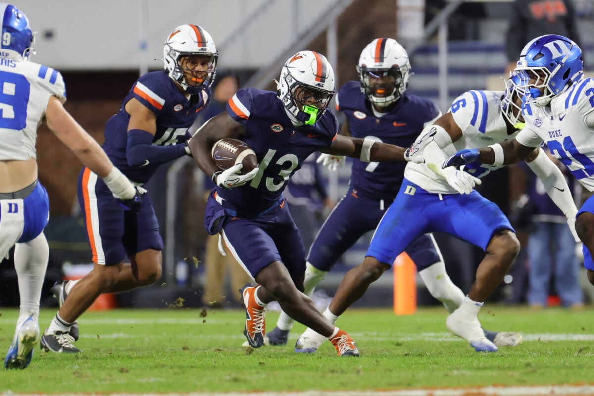 Oct 23, 2026; Charlottesville, Virginia, USA; Virginia Cavaliers wide receiver Josiah Abdullah (13) carries the ball against the Duke Blue Devils during the first half at Scott Stadium. Mandatory Credit: Amber Searls-Imagn Images