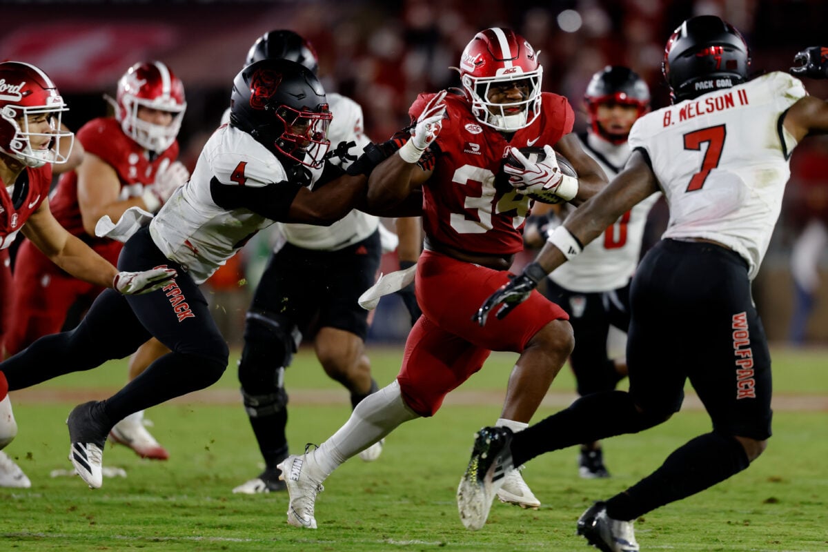 Oct 23, 2026; Stanford, California, USA; Stanford Cardinal running back Champ Hampton (34) runs with the ball against the NC State Wolfpack during the third quarter at Stanford Stadium. Mandatory Credit: Sergio Estrada-Imagn Images