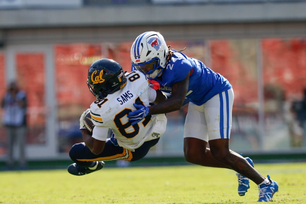 Oct 24, 2026; Dallas, Texas, USA; California Golden Bears wide receiver Tyree Sams (81) is tackled by SMU Mustangs safety Sael Reyes (22) during the second half at Gerald J. Ford Stadium. Mandatory Credit: Chris Jones-Imagn Images