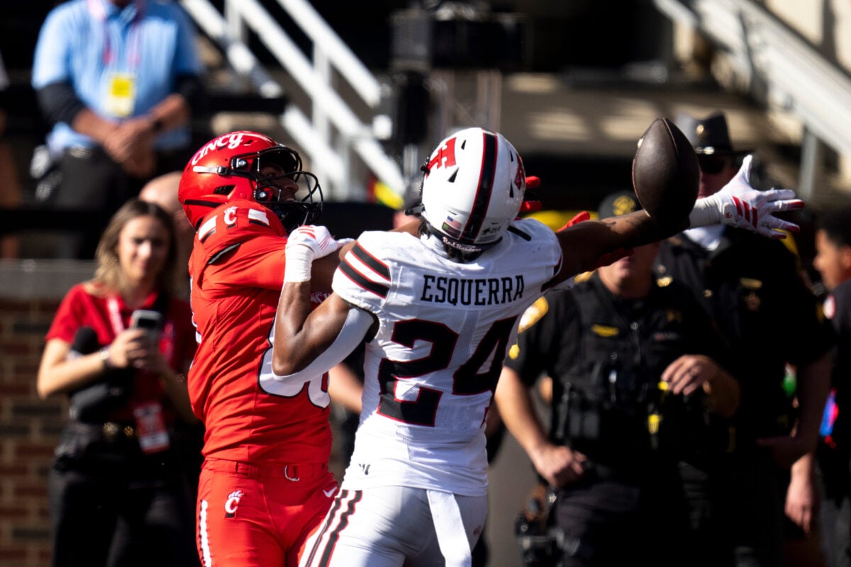 Texas Tech safety Malik Esquerra (24) knocks the ball away from Cincinnati Bearcats wide receiver Jalen Williams (80) in the fourth quarter of the Big 12 game between Cincinnati Bearcats and Texas Tech at Nippert Stadium in Cincinnati on Saturday, October 24, 2026.