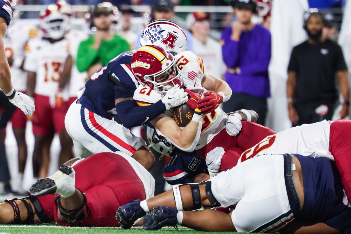 Oct 24, 2026; Tucson, Arizona, USA;  Iowa State Cyclones running back Aiden Flora (21) is tackled during the third quarter against the Arizona Wildcats at Casino Del Sol Stadium.  Mandatory Credit: Aryanna Frank-Imagn Images